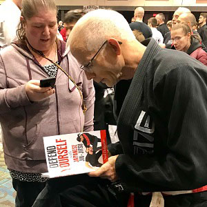 Neil Dalgarno signing his Self Defense book